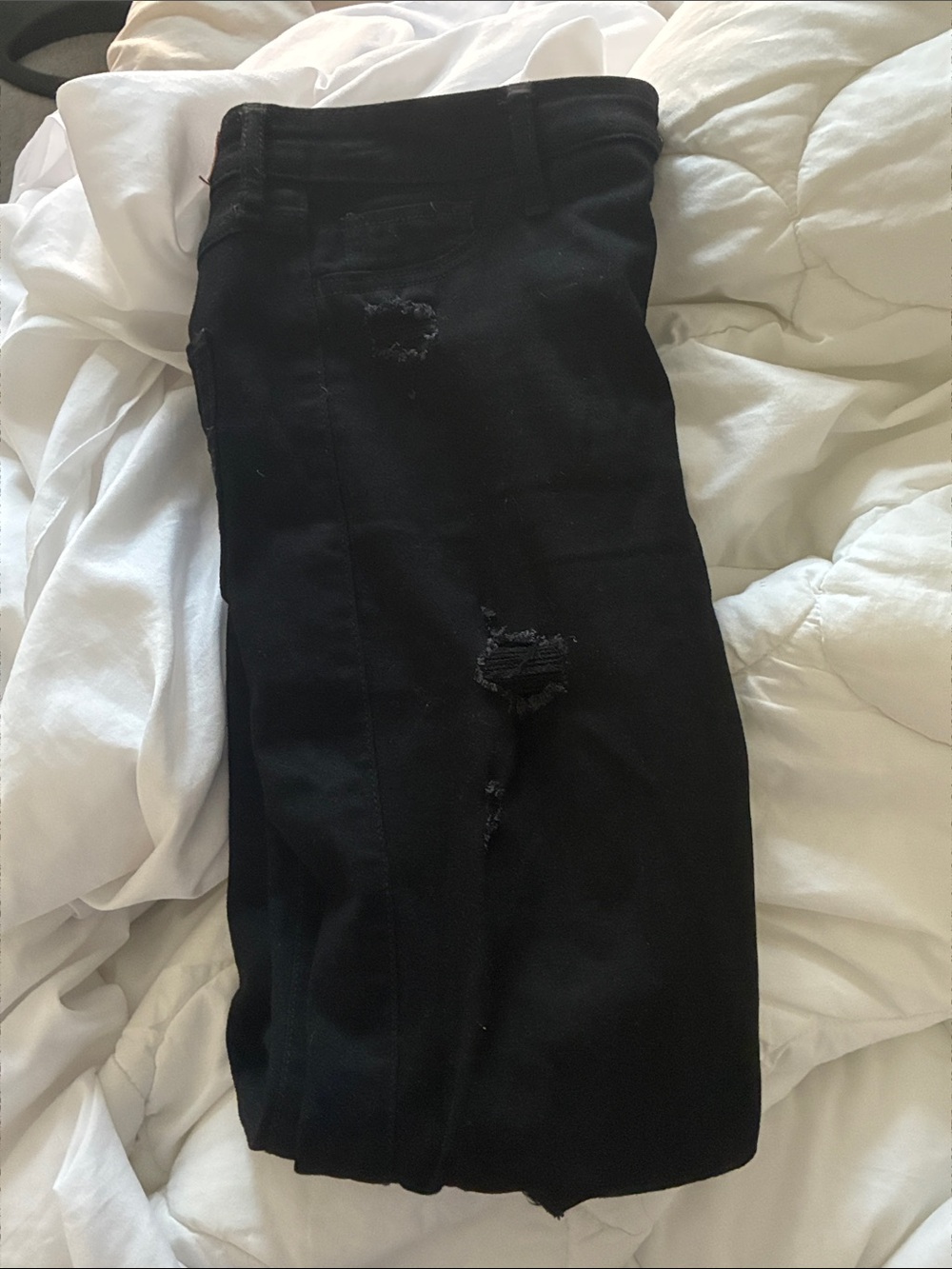 Women’s skinny ripped black jeans